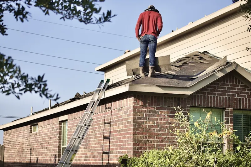 Professional roofer working on a residential roof in Edgemere Estates
